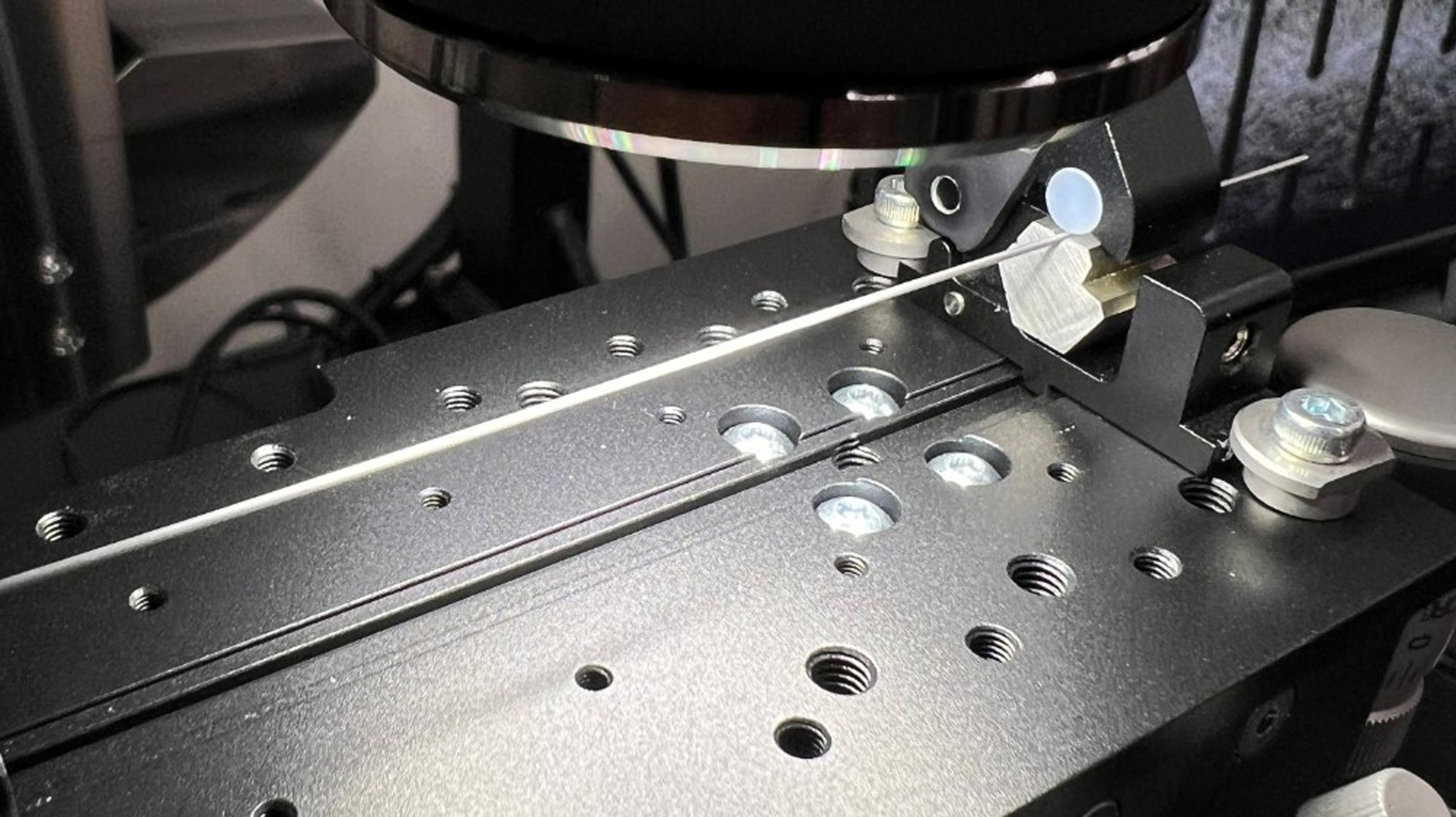 An image of the laser-cut Hypotube (LCHT) with the testing equipment used.