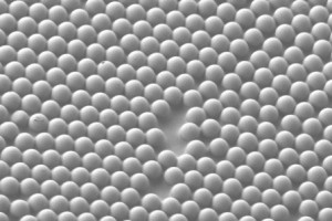 A scanning electron microscope image shows the microscale concave interface structure that was studied The material consists of microspheres partially embedded in sticky tape, forming microscale concave interfaces Credit Jacob Rada A scanning electron microscope image shows the microscale concave interface structure that was studied The material consists of microspheres partially embedded in sticky tape, forming microscale concave interfaces Credit Jacob Rada