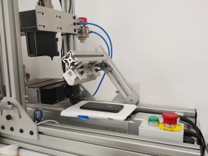 In this mobile phone inspection setup, the 3DPIXA line scan camera is set at a resolution of 30 m x 30 m x 10 m to detect surface 2D and 3D defects photo courtesy of Active Inspection