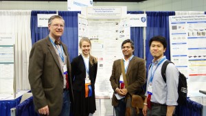 Judges congratulate first-place SPIE Special Award winner Nicky Wojtania at Intel ISEF 2017 from left are John Tamkin, Wojtania, Pramod Butte, and Pang Yu Yeng