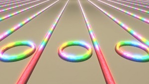 Illustration showing an array of microring resonators on a chip converting laser light into frequency combs Illustration showing an array of microring resonators on a chip converting laser light into frequency combs