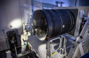 LSST Camera Deputy Project Manager Travis Lange shines a flashlight into the LSST Camera, a massive camera the size of a small car Image courtesy of Jacqueline Ramseyer OrrellSLAC National Accelerator Laboratory