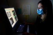 Senior study author Nazlee Zebardast, MD, MSc, director of Glaucoma Imaging at Mass Eye and Ear, examines OCT images CREDIT Mass Eye and Ear