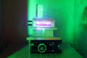 This gas cell is a key component of a compact wakefield laser accelerator developed at The University of Texas at Austin Inside, an extremely powerful laser strikes helium gas, heats it into a plasma and creates waves that kick out electrons from the gas