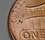 The microrobot can be seen just to the right of the U in United States on this US penny Purdue University imageGeorges Adam