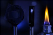 To measure how well the film twists light at high temperatures, U-M researchers use a small flame as a light and heat source Photo credit Brenda Ahearn, Michigan Engineering